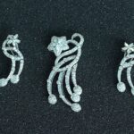 Broche floral pavé + Aretes florales